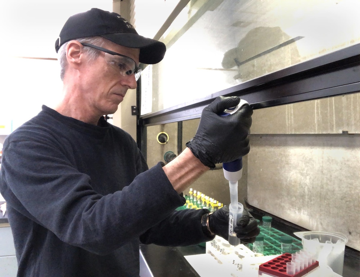 Steve Balogh, principal research scientist at the Metro Plant in St. Paul, prepares samples of wastewater in a lab in March 2021.